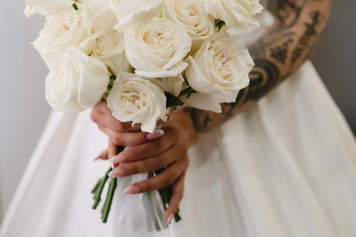 The bridal bouquet of white roses at a real wedding at Frà Viaco